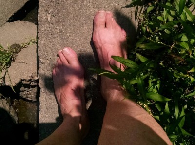 Bare feet on the concrete weir in the ditch behind Winfield Village.