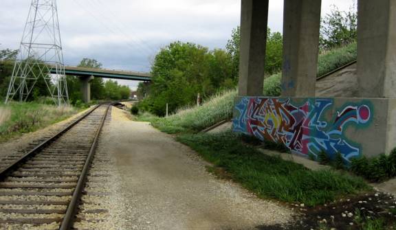 [Photo of graffiti and railroad near Kaufman Lake