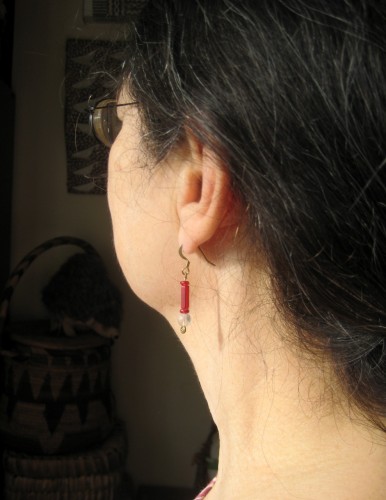 Jackie wearing the Elisem earrings "Honor is not Always Loud"