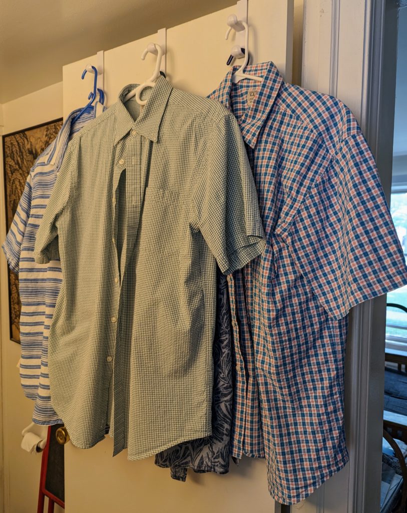 Freshly ironed shirts on hangers