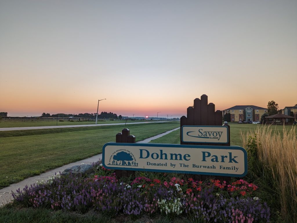 Dawn sky beyond the Dohme Park sign