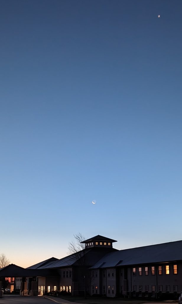 Crescent moon over the roof of the apartment complex next door to Winfield Village