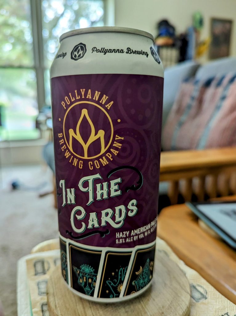 A can of In the Cards, from Pollyanna Brewing, sitting on a coaster