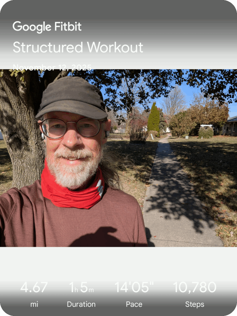 Selfie with a footpath behind me, and run stats across the top and bottom of the image
