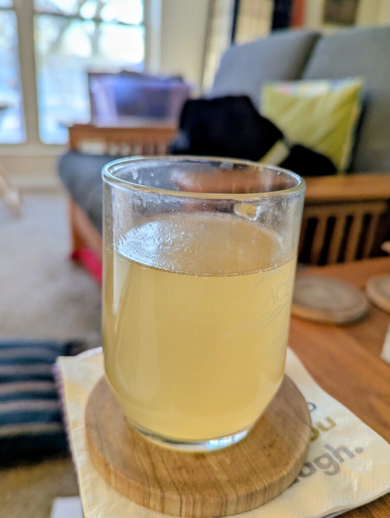 A mug mostly full of chicken broth