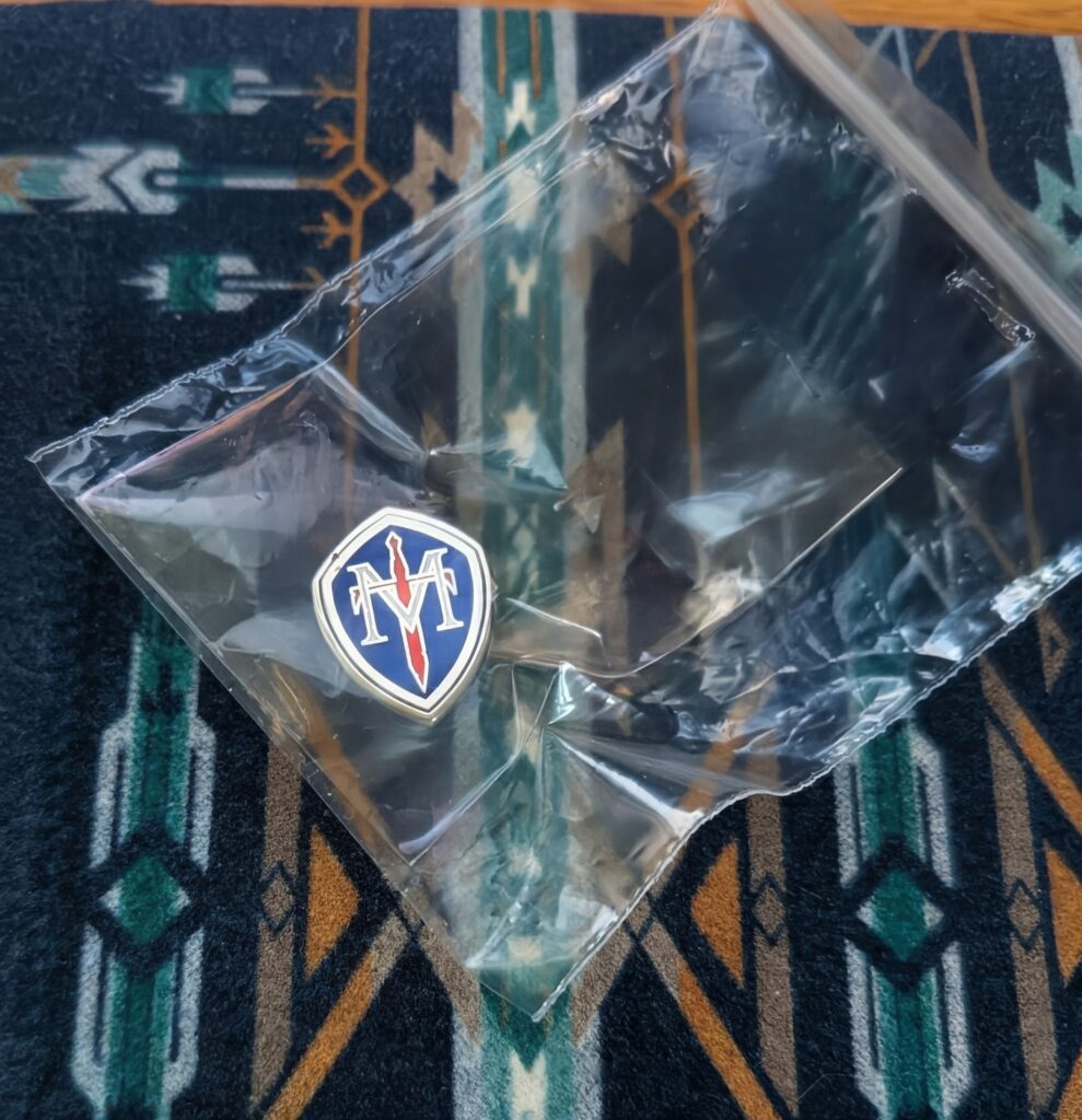 TMHF lapel pin in a ziplock bag